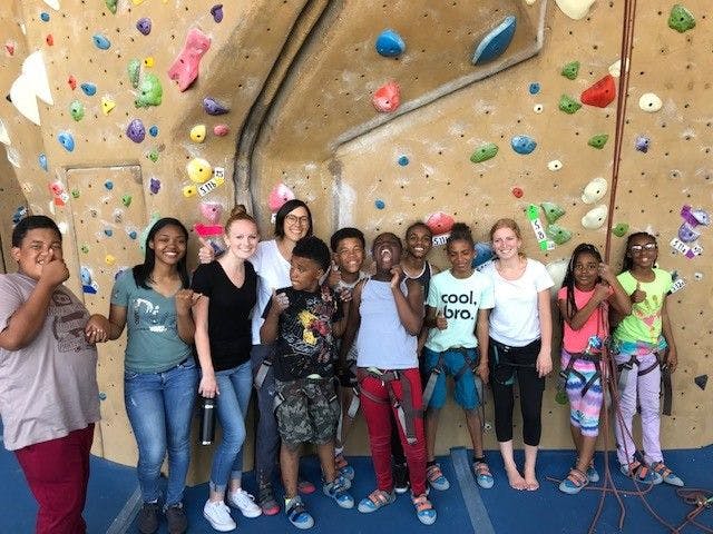 COS children and volunteers on a rock climbing trip